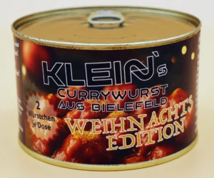 Dose der Klein’s Currywurst Weihnachts Edition – handgemachte Currywurst aus Bielefeld mit festlicher Rezeptur und winterlichen Gewürzen, ideal für die Weihnachtszeit. Die Weihnachtliche Currywurst.